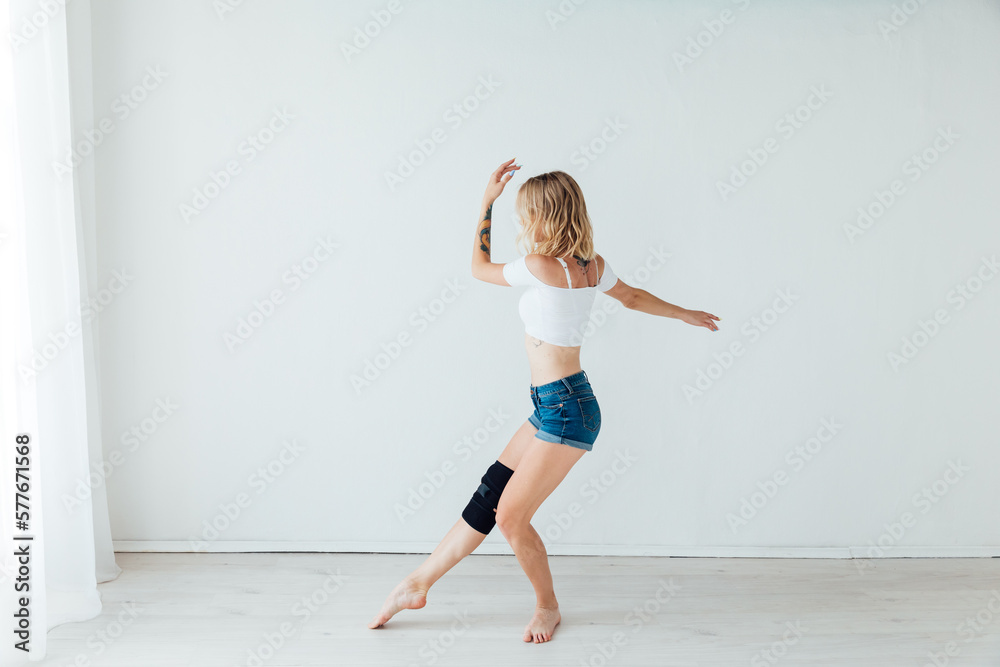woman shows movements dancing in the studio in the hall