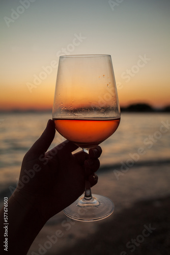 glass of wine on sunset