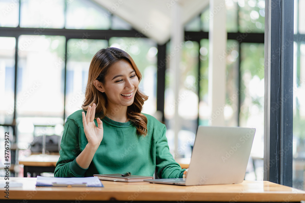 Asian female entrepreneur who uses a calculator to do calculations. Business performance documents of accounting firms, auditors, freelance, finance and investment Tax calculation and budget each year