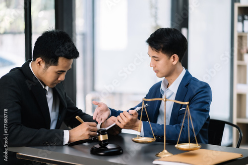 Lawyer business man working with paperwork on his desk in office workplace for consultant lawyer in office.