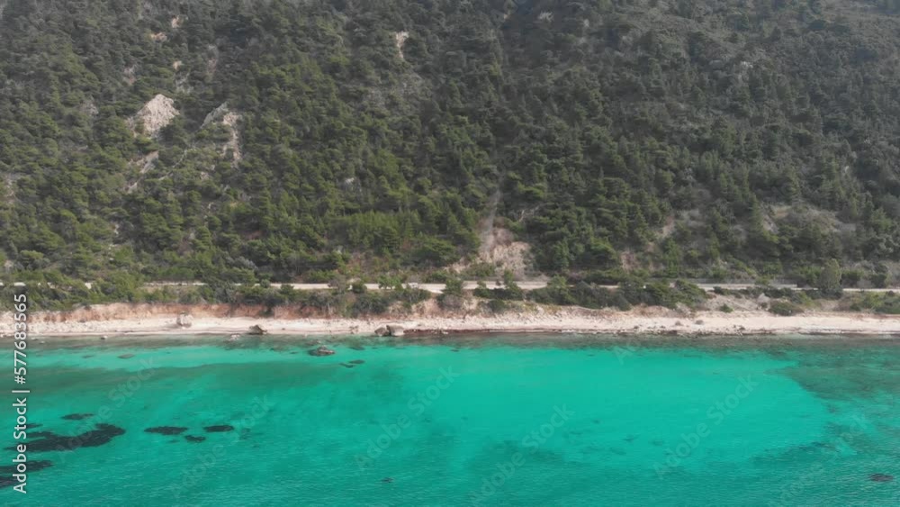 Aerial view of beautiful empty beach in Greece, no people. Dramatic coastline scenic bay rocky cliffs in the Ionian island, Port Katsiki, Lefkada. Blue turquoise waving sea. Aerial view of beautiful empty beach in Greece, no people. Dramatic coastline scenic bay rocky cliffs in the Ionian island, Port Katsiki, Lefkada. Blue turquoise waving sea.