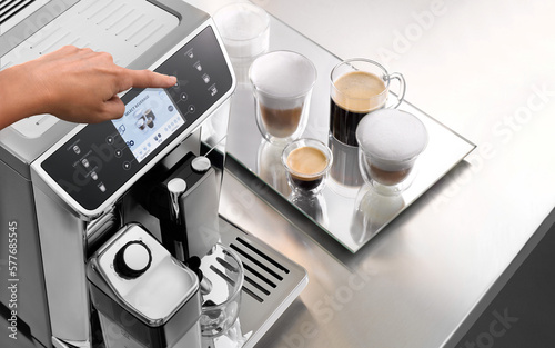 Fototapete Hand select beverage on an automatic coffee machine