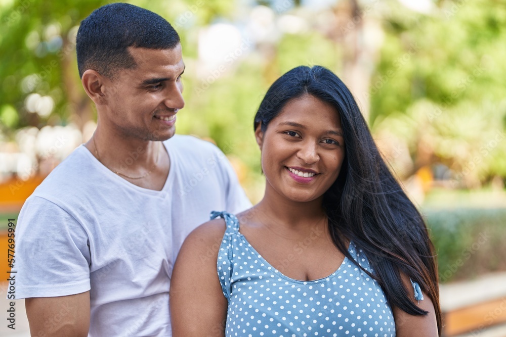 Man and woman couple smiling confident standing together at park Man and woman couple smiling confident standing together at park