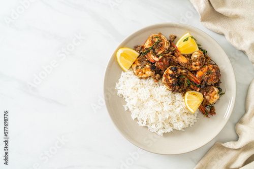 jerk shrimps or grilled shrimps in Jamaica style with rice photo