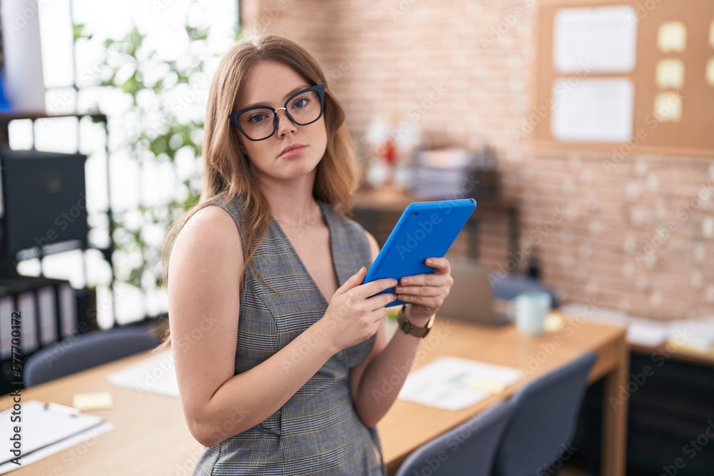 Caucasian woman working at the office wearing glasses looking sleepy and tired, exhausted for fatigue and hangover, lazy eyes in the morning. Caucasian woman working at the office wearing glasses looking sleepy and tired, exhausted for fatigue and hangover, lazy eyes in the morning.