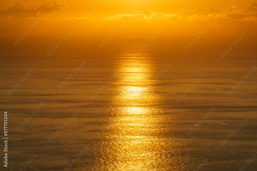 Bright orange landscape above the sea surface