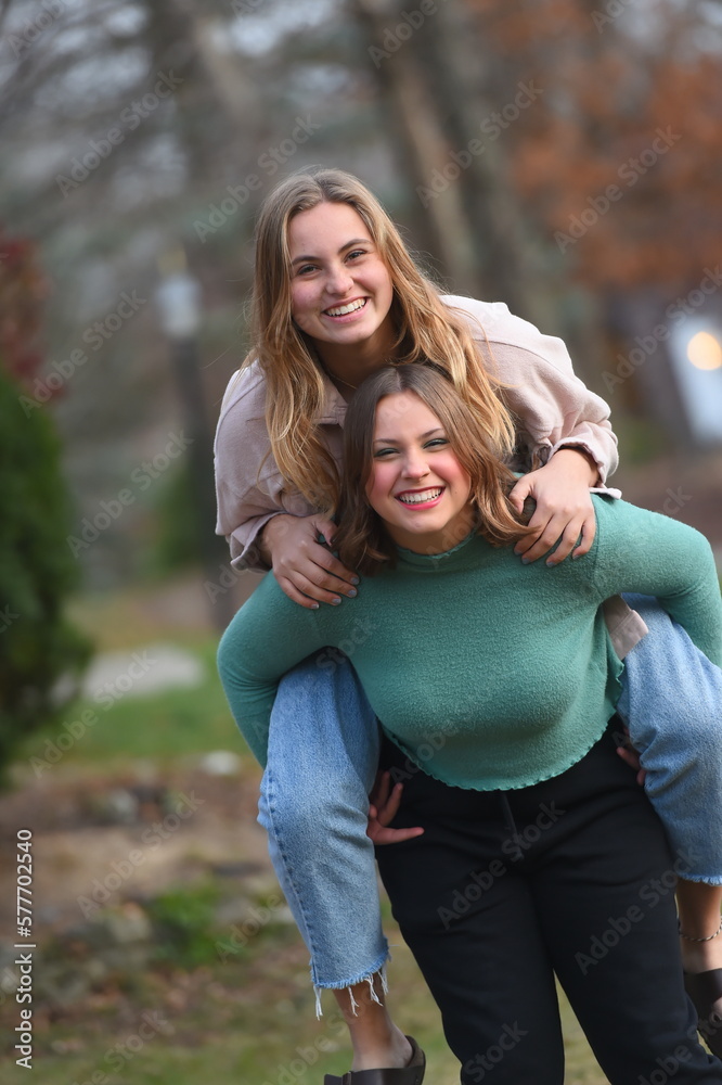 Fototapeta premium Teen Girls Piggyback Fun