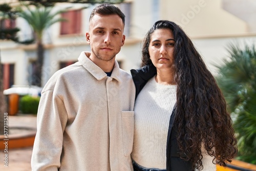 Cuadro en lienzo Man and woman couple standing together with relaxed expression at park