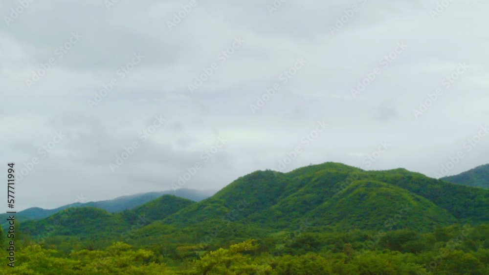 Timelapse Beautiful view of a mountain view with moving clouds Timelapse Beautiful view of a mountain view with moving clouds