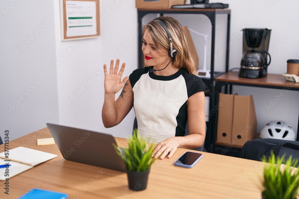 Young beautiful hispanic woman call center agent having video call at office Young beautiful hispanic woman call center agent having video call at office