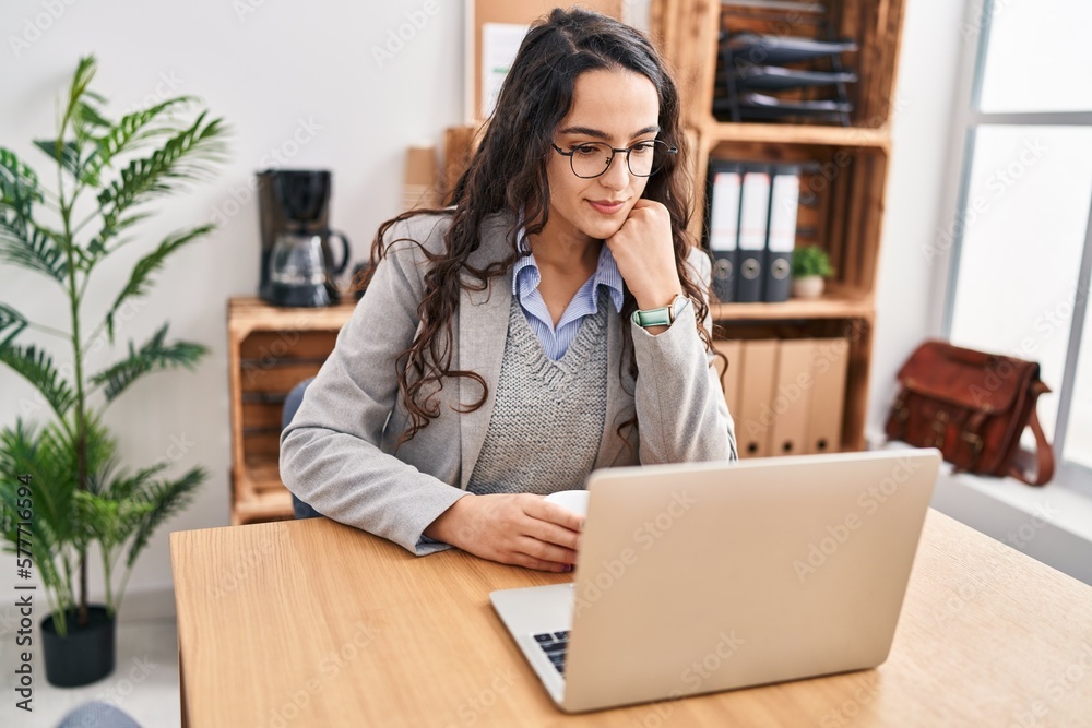 Young hispanic woman business worker using laptop working at office Young hispanic woman business worker using laptop working at office