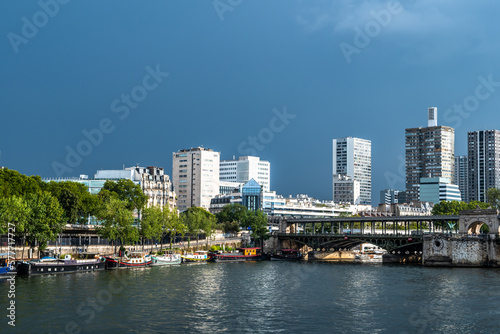 River Seine In Paris  France With Promenade  Anchored Houseboats And Modern Office Buildings