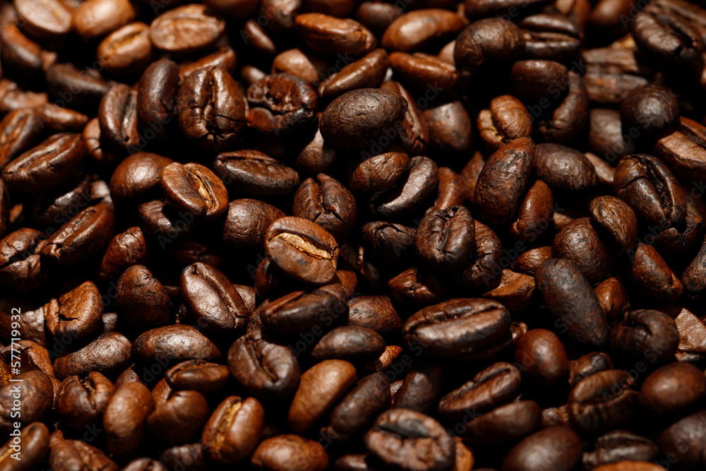 photo macro close up texture of roasted coffee beans dark, can be used as a background.. photo macro close up texture of roasted coffee beans dark, can be used as a background..
