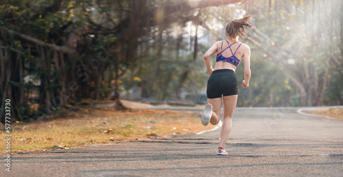 Young woman runner running in the park. © NAMPIX