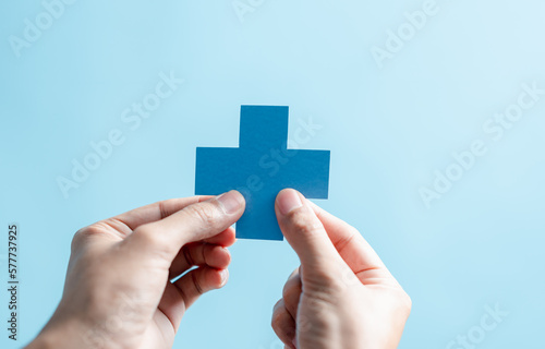 Fototapeta Naklejka Na Ścianę i Meble -  Health insurance concept. people hands holding plus and healthcare medical icon, health and access to welfare health concept.