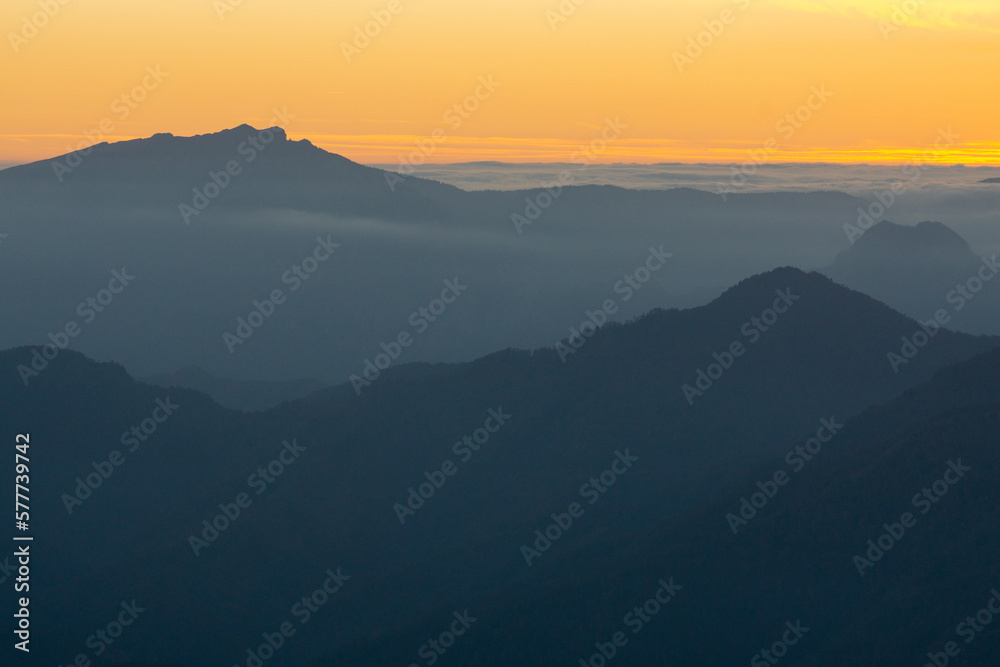 Sunset mountain landscape background in Cozia National Park in autumn that inspires calm and peace