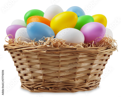 Wall Mural happy Easter decoration, wicker basket full of colored easter eggs in pastel light colors on straw nest, isolated on background