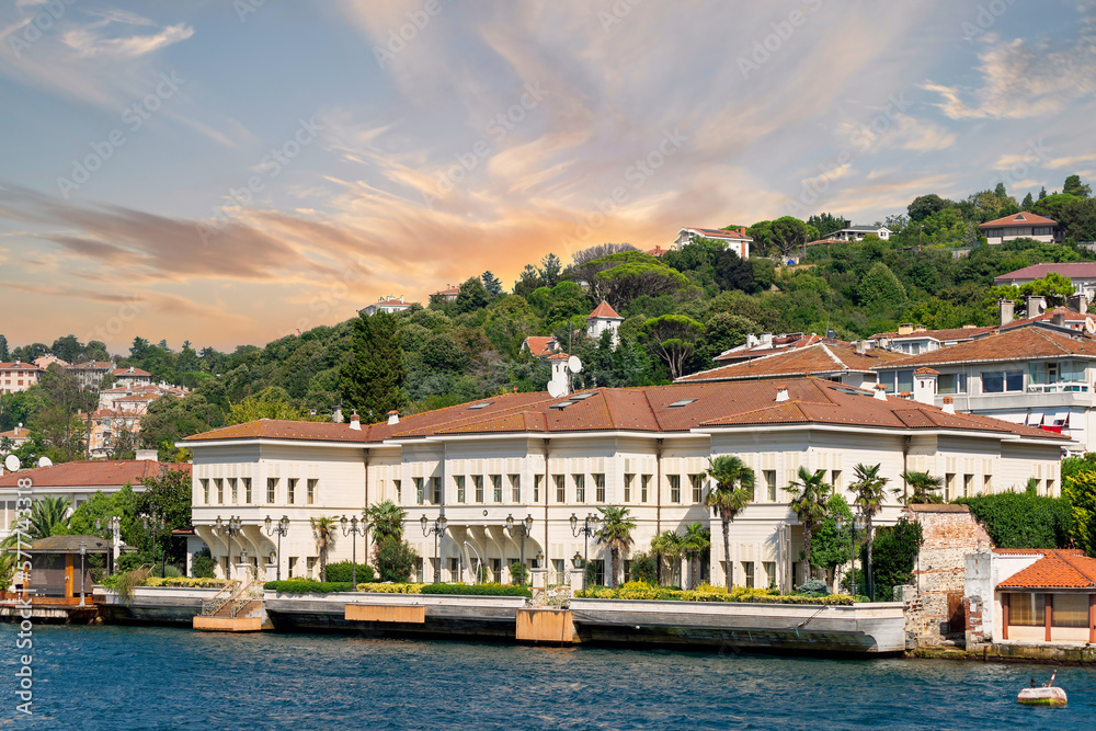 View from the sea of Saffet Pasa Mansion, or Saffet Pasa Mansion, with the green mountains of the Europian side of Bosphorus in the background, with dense trees, Istanbul, Turkey