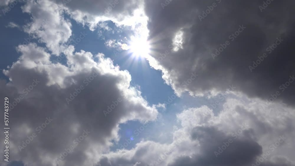 Sun Rays in Clouds, Dramatic Sunset, Sunrise on Blue Sky, Puffy Cloudy Day, Climate Crisis, Global Warming, Cloudscape Sun Rays in Clouds, Dramatic Sunset, Sunrise on Blue Sky, Puffy Cloudy Day, Climate Crisis, Global Warming, Cloudscape