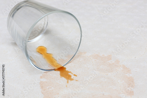 Stains on the mattress of the bed about spilled drink from the glass. The concept of stain removal and cleaning