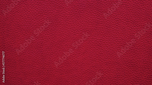 Texture of pink, crimson grained leather as a background. Natural material, top view.