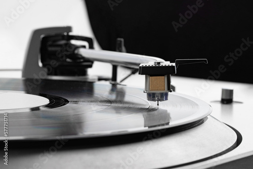 retro vinyl record player with needle, details and control buttons