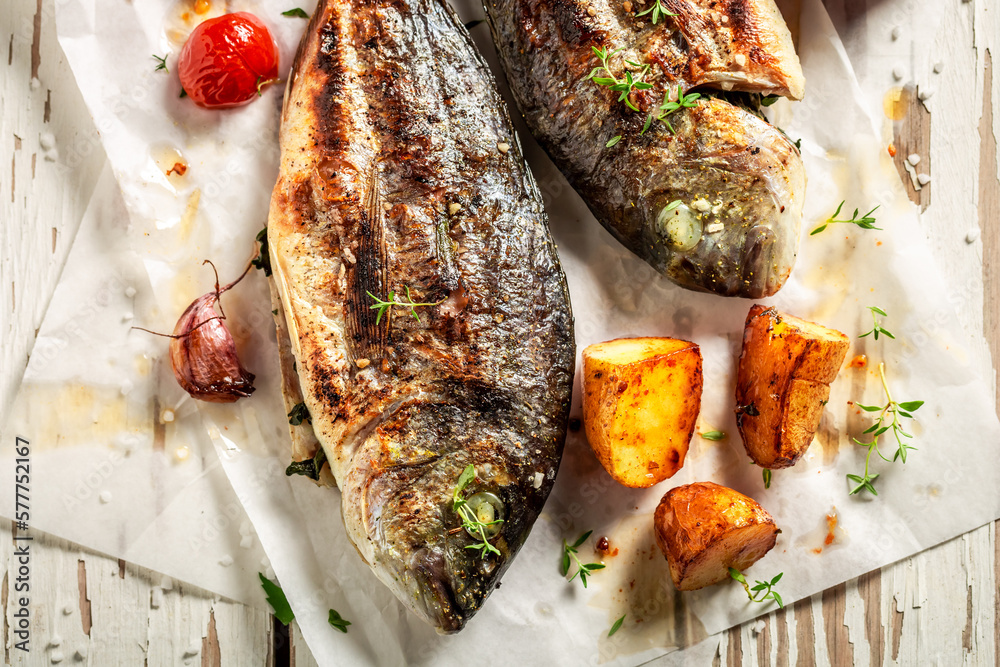 Roasted sea bream with potatoes, cherry tomatoes and thyme