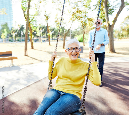 woman man outdoor senior couple happy swing swinging fun leisure retirement together love elderly active vitality