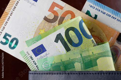 Euro bills notes almost fell out of the wallet
