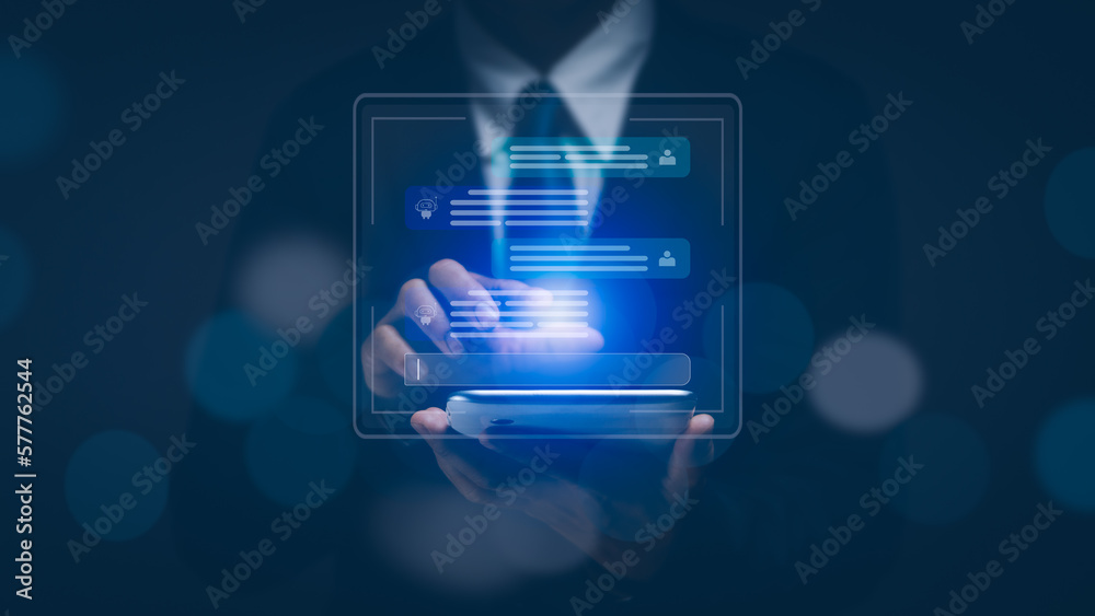 Businessman using tablet showing text message dialogue helper for planning and analyzing corporate business data,Concept Chatbot (AI) technology, artificial intelligence robots, future innovations