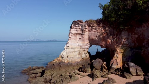 Orbital drone footage of Laem Chamuk Khwai Rock on sunny day. Thalane, Krabi Province, Thailand. photo