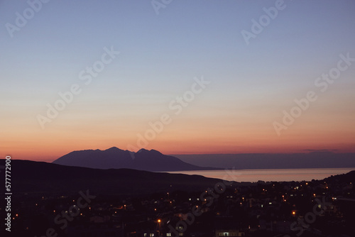 Sunset over the island of Gokceada. Distant view of Samothrace island in greece at sunset from Gokceada center on Imbros Gokceada, Çanakkale Turkey 