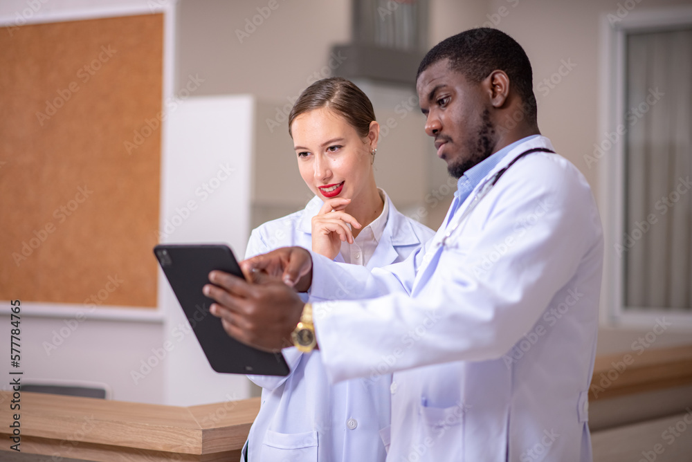 Healthcare professionals discussing in hospital. Medical staff during morning briefing in boardroom Healthcare professionals discussing in hospital. Medical staff during morning briefing in boardroom
