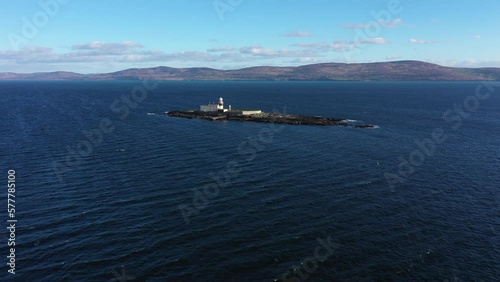 Aerial footage Roancarrigmore Lighthouse, Bantry Bay, West Cork, Ireland 4K
Shot by a drone moving backward.. Rocky coast and rough sea waves. photo