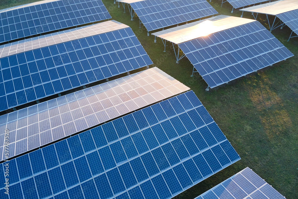 Aerial view of large sustainable electrical power plant with rows of ...