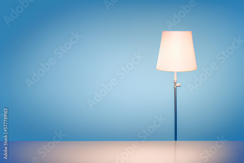 Stylish lamp on blue background