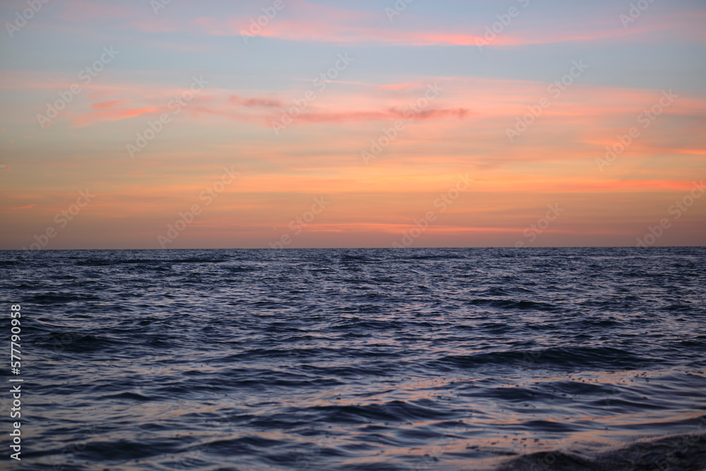 Dramatic red ocean waves at sunset with soft evening sea dark water Dramatic red ocean waves at sunset with soft evening sea dark water
