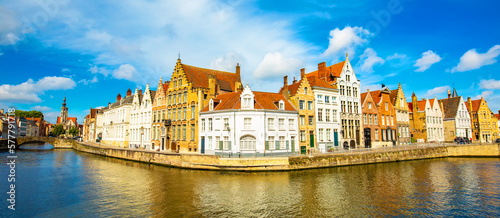 Panoramic view of Brugge old town and water canal, wide angle photo