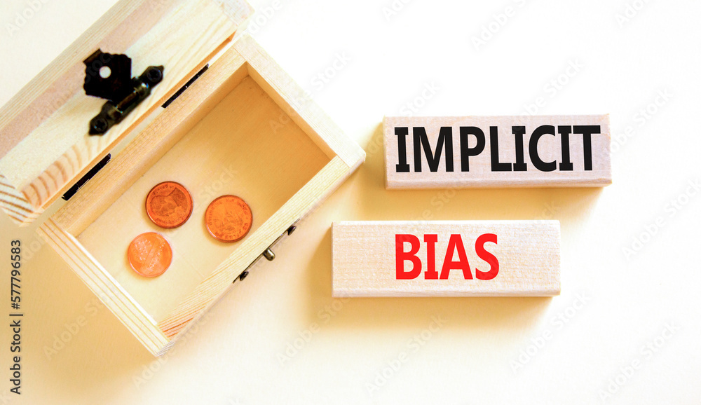 Implicit bias symbol. Concept words Implicit bias on wooden block. Beautiful white table white background. Beautiful wooden chest with coins. Business psychology implicit bias concept. Copy space. Implicit bias symbol. Concept words Implicit bias on wooden block. Beautiful white table white background. Beautiful wooden chest with coins. Business psychology implicit bias concept. Copy space.