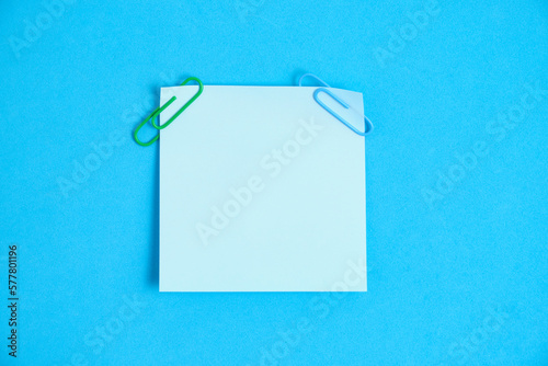 Blue paper stickers for writing notes on a blue background.