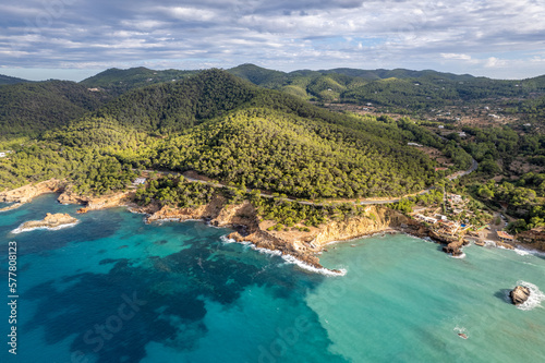 Aerial photographs of the beaches of Cala Xarraca , on the island of Ibiza during a sunny summer day with blue sky and turquoise water photo