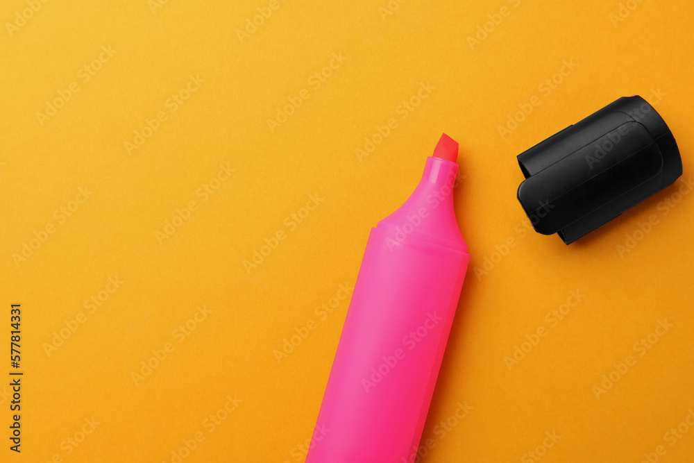 Bright marker on orange background, flat lay. Space for text Bright marker on orange background, flat lay. Space for text