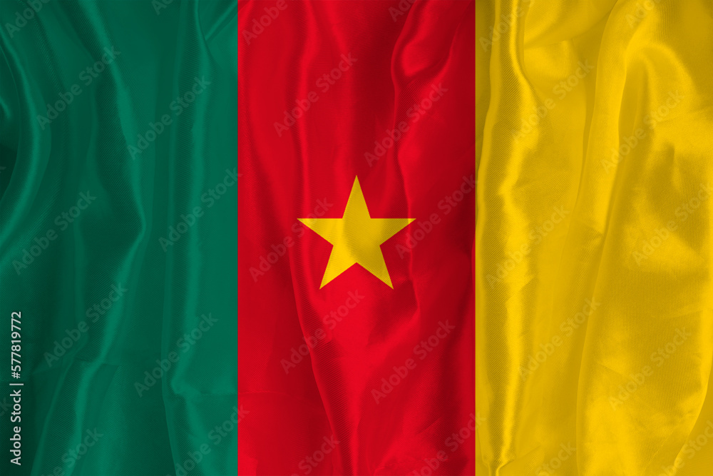 The flag of Cameroon on a silk background is a great national symbol. Fabric texture The official state symbol of the country. The flag of Cameroon on a silk background is a great national symbol. Fabric texture The official state symbol of the country.