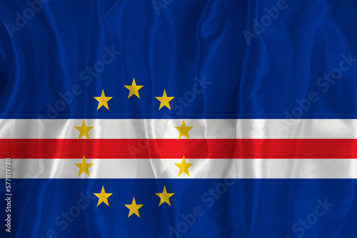 Flag of Cape Verde on a silk background is a great national symbol. Fabric texture The official state symbol of the country.