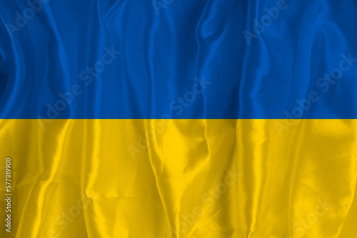 The flag of Ukraine on a silk background is a great national symbol. Fabric texture The official state symbol of the country