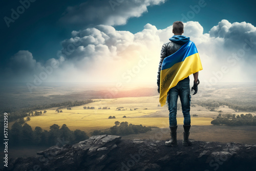 Ukrainian Flagbearer Stands Proud on Mountain Top, Gazing at the Horizon - A Symbol of Freedom