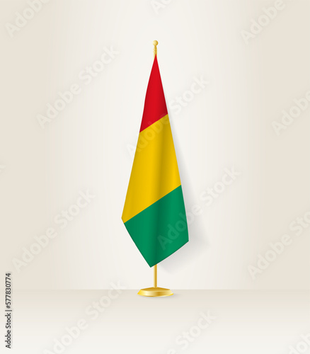 Guinea flag on a flag stand.