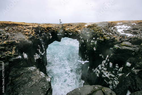 a couple is kissing against the background of a winter landscape from Iceland photo