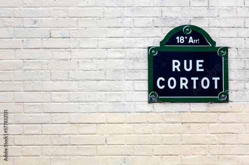 Fototapeta Naklejka Na Ścianę i Meble -  Traditional Paris plaque with the street name on white brick wall, France