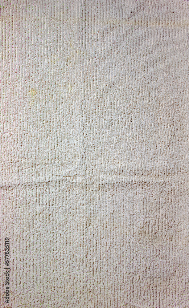 Fototapeta premium The texture of a light beige bath towel with a large volume